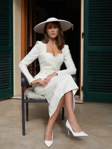 Detailed close-up view of the elegant white French square-neck blazer and midi skirt set.
