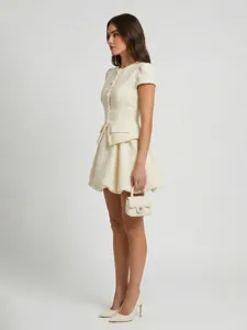 Elegant ivory tweed mini dress featuring short sleeves, round neck and flared bubble skirt.