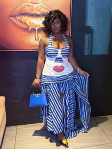 Retro striped halter top and maxi skirt two-piece set with red lip print for women.