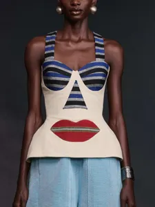 Detailed view of the stylish halter top featuring striped cups and a red lips patch.