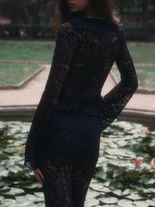 Black lace two-piece set, long sleeve top and matching pants, vintage resort style outfit.