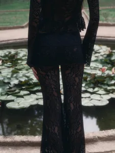 Detailed back view of the black lace two-piece set, featuring delicate floral lace patterns.