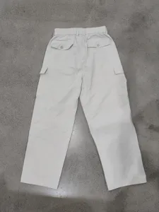 Detail view of men's casual cargo pants back pocket design, loose fit straight trousers style.