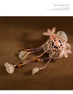 Exquisite detail of rose gold flower hair clip with dangling crystal tassel and mesh petals.