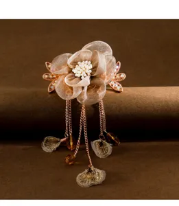 Chic mesh flower hair clip with vintage tassels, elegant dangling chains for unique hairstyles.