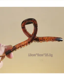 Brown frosted cross hair claw clip for women, stylish large shark hair accessory!