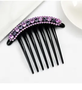 Black plastic hair insert comb with purple rhinestones. Detailed view of chic women hair clip.