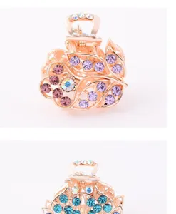 Detailed close-up of a sparkling rhinestone metal claw clip with delicate colorful crystals.