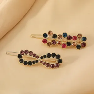 Fashion crystal hair clips set for women, elegant rhinestone metal barrettes for styling.