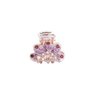 Korean style small hair claw clip featuring rose gold finish and purple crystal stones.