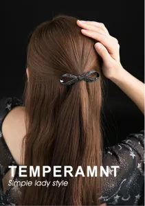 Black crystal bow hair clip for women, elegant rhinestone spring hairpin for ponytail styles.