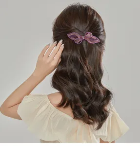 Elegant purple rhinestone bow hair clip for women, sparkling crystal spring hairpin for back of head.