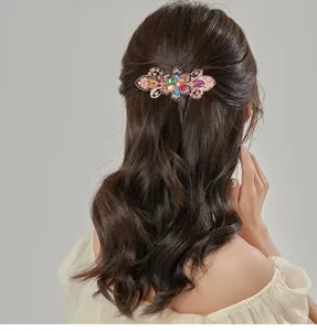 Detailed view of the vintage crystal butterfly hair clip showing its sparkling rhinestones.