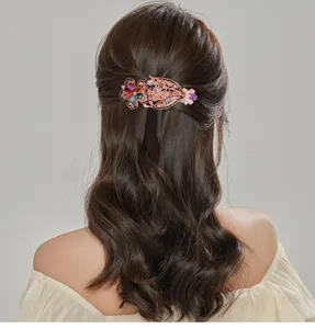 Elegant crystal rhinestone hair clip for women, sparkling floral spring barrette detail view.