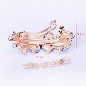 Elegant Korean rhinestone floral spring hair clip in rose gold with blue crystals.