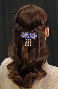 Elegant blue butterfly hair claw clip with rhinestones and metal tassels for stylish women.