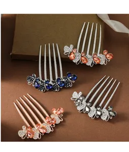 Rhinestone butterfly hair comb detail, elegant metal insert comb for buns and styling.