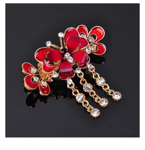 Elegant red butterfly hair claw clip with crystal rhinestones and cascading tassel chains.