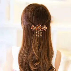 Vintage floral hair claw clip with crystal tassel dangle, elegant half-up hair accessory.