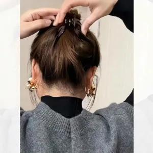 Detail view of Korean style small pumpkin hair claw clip, perfect for elegant daily updo styles.