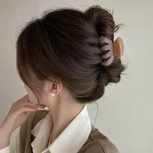 Small pumpkin hair claw clip for women, elegant Korean style hair styling accessory for daily use.