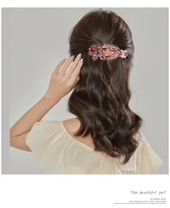 Elegant rhinestone hair clip for women, sparkling crystal spring barrette hair accessory.