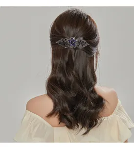 Retro rhinestone spring hair clip close-up, elegant floral hair accessory for women.