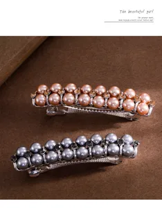 Close-up detail of elegant pearl and rhinestone hair clip, secure metal spring barrette style.