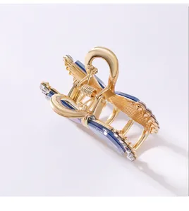 Molla per Capelli in Metallo Dorato e Acetato Blu Elegante Fiocco Strass Donna