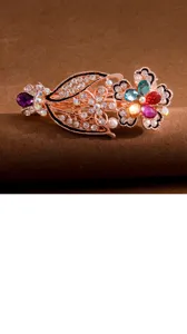 Detailed view of the crystal rhinestone hair clip featuring colorful floral design and spring clip.