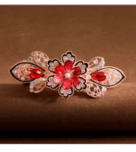 Exquisite rhinestone crystal flower ponytail hair clip with red gems and rose gold alloy.