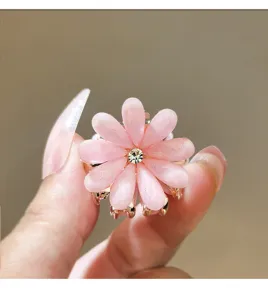 Pink flower hair claw clip with sparkly rhinestone center, cute mini hair catch for women.