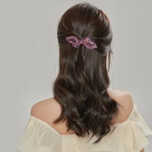 Elegant rhinestone bow hair clip for women, sparkling purple crystal back hair barrette pin.