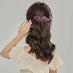 Elegant rhinestone butterfly hair clip, sparkling crystal barrette for stylish back head hairstyles.