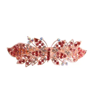 Detailed close-up of a rose gold rhinestone hairpin featuring a delicate butterfly and leaf design.