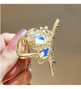 Golden crystal hair claw clip with colorful rhinestones for stylish daily hair styling.