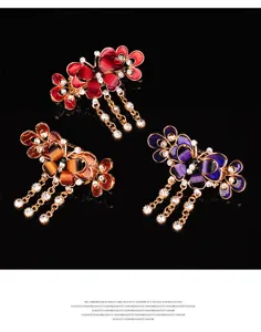 Elegant butterfly tassel hair claw clip with sparkly rhinestones and chic metal hanging chains.