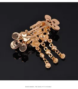 Gold butterfly tassel hair clip elegant metal barrette back hair accessory for women.