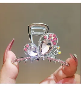 Crystal bow hair claw clip, silver metal with pink rhinestones and teardrop crystals for women.