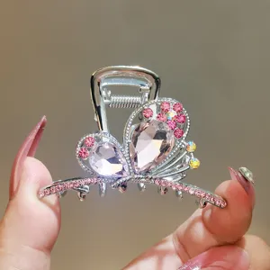 Crystal butterfly hair claw clip with pink rhinestones, elegant metal shark hair clip for women.