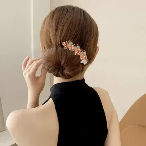 Elegant rhinestone butterfly hair comb for women, stunning updo bun pin hair accessory.