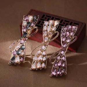 Elegant rhinestone hair clips set, sparkling crystal bow barrettes for women and girls daily wear.