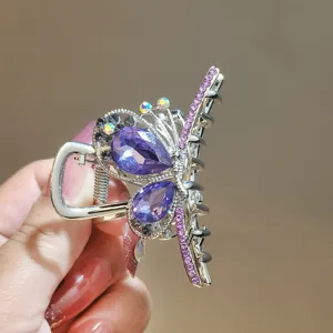Crystal bow hair claw clip with purple rhinestones for women, elegant daily hair accessories.