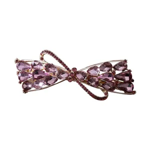 Elegant purple rhinestone bow hair clip for women, sparkling crystal barrette for ponytail styling.