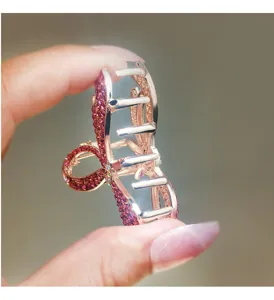 Detailed view of the elegant rose gold rhinestone bow hair claw clip for women's stylish updos.
