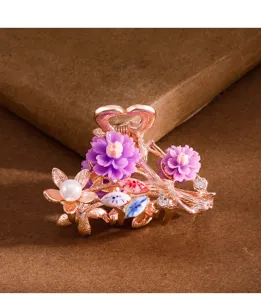 Elegant rose gold floral hair claw clip with purple flowers and pearls for daily hair styling.