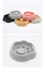 Pet slow feeder bowl detail view, claw shape design, anti-choking pet bowl closeup, plastic.