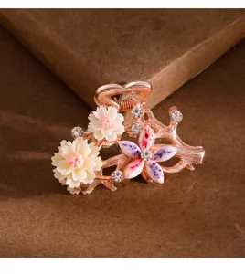 Crystal hair claw clip detail, elegant small floral hair accessory for women styling.