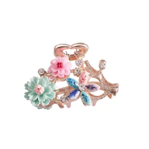 Gold-tone floral hair claw clip with colorful enamel flowers and sparkling rhinestones for women.