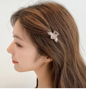Petite pince à cheveux pour femme perle cœur aile design métal jolie barrette frange